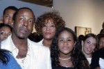 Bobby Brown, Whitney Houston and daughter Bobbi Kristina watch the premiere of 'Being Bobby Brown,' Atlanta, on June 27, 2005 -- Getty Premium