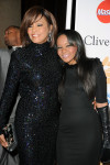 Whitney Houston (L) and her daughter Bobbi Kristina Brown in February 2011