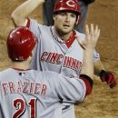 Cincinnati Reds' Chris Heisey celebrates his two-run home run against the Arizona Diamondbacks with Todd Frazier (21) in the seventh inning of a baseball game, Wednesday, Aug. 29, 2012, in Phoenix. (AP Photo/Ross D. Franklin)