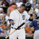 Detroit Tigers' Miguel Cabrera drops his bat and helmet after striking out against Cleveland Indians starting pitcher Zach McAllister in the first inning of a baseball game, Friday, Aug. 30, 2013, in Detroit. Cabrera was pulled from the game after two innings. The Tigers defeated the Indians 7-2 in a seven inning, rain shortened game. (AP Photo/Duane Burleson)