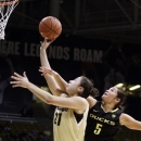 Colorado's Jasmine Sborov (21) shoots as Oregon's Jordan Loera defends during the second half of an NCAA college basketball game in Boulder, Colo., Sunday, Feb. 10, 2013. Colorado won 84-59. (AP Photo/Brennan Linsley)