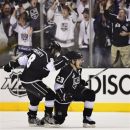 Los Angeles Kings right wing Dustin Brown (23) and Los Angeles Kings defenseman Drew Doughty (8) celebrate after Brown scored his second goal of the first period against the New Jersey Devils during Game 6 of the NHL hockey Stanley Cup finals, Monday, June 11, 2012, in Los Angeles.  (AP Photo/Mark J. Terrill)