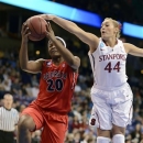 Georgia's Shacobia Barbee (20) makes a drive as Stanford's Joslyn Tinkle (40) gets a hand on the ball in the first half of a regional semifinal in the NCAA women's college basketball tournament, Saturday, March 30, 2013, in Spokane, Wash. (AP Photo/Jed Conklin)