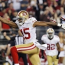 San Francisco 49ers wide receiver Michael Crabtree (15) scores a touchdown against the Arizona Cardinals during the first half of an NFL football game, Monday, Oct. 29, 2012, in Glendale, Ariz. (AP Photo/Ross D. Franklin)