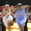 CORRECTS TO RUFFIN-PRATT NOT RUFFIN - North Carolina's Tierra Ruffin-Pratt, right, races downcourt on a turnover as Maryland's Tianna Hawkins pursues during the first half of an NCAA college basketball game on Thursday, Jan. 24, 2013, in College Park, Md. (AP Photo/Gail Burton)