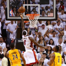 MIAMI, FL - MAY 22: LeBron James #6 of the Miami Heat drives and makes the game winning basket in overtime against the Indiana Pacers during Game One of the Eastern Conference Finals at AmericanAirlines Arena on May 22, 2013 in Miami, Florida. (Photo by Mike Ehrmann/Getty Images)