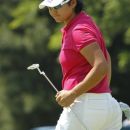 Yani Tseng, of Taiwan, reacts after missing a putt during the Wegmans LPGA Championship at Locust Hill Country Club in Pittsford, N.Y., Sunday, June 10, 2012. (AP Photo/Derek Gee)