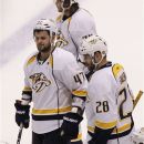 Nashville Predators' Alexander Radulov (47), of Russia, Paul Gaustad (28) and Sergei Kostitsyn, of Russia, skate off the ice after an overtime loss to the Phoenix Coyotes in Game 1 of an NHL hockey Stanley Cup Western Conference semifinal playoff series, Friday, April 27, 2012, in Glendale, Ariz. The Coyotes won 4-3. (AP Photo/Ross D. Franklin)