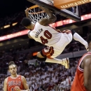 Miami Heat's Udonis Haslem (40) dunks in front of Chicago Bulls' Joakim Noah (13) during the first half of Game 5 of an NBA basketball Eastern Conference semifinal, Wednesday, May 15, 2013, in Miami. (AP Photo/Wilfredo Lee)