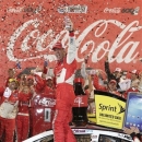 Kevin Harvick celebrates in victory lane after winning the NASCAR Sprint Cup series Coca-Cola 600 auto race at Charlotte Motor Speedway in Concord, N.C., Sunday, May 26, 2013. (AP Photo/Chuck Burton)
