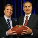 FILE - In this Aug. 8, 2012, Roger Goodell, left, the NFL's chief operating officer, and Paul Tagliabue, NFL commissioner, pose for photos after Goodell was selected to succeed Tagliabue as the league's new commissioner at an NFL meeting in Northbrook, Ill. Goodell appointed Tagliabue on Friday, Oct. 19, 2012, to hear the appeals of four players suspended in the New Orleans Saints bounties scandal.(AP Photo/M. Spencer Green, File)