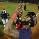 Boston Red Sox designated hitter David Ortiz applauds after defeating the St. Louis Cardinals in Game 6 of baseball's World Series Wednesday, Oct. 30, 2013, in Boston. The Red Sox won 6-1 to win the series. (AP Photo/David J. Phillip)