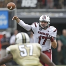 South Carolina quarterback Dylan Thompson (17) throws a pass over Central Florida linebacker Troy Gray (57) during the first half of an NCAA college football game in Orlando, Fla., Saturday, Sept. 28, 2013.(AP Photo/John Raoux)