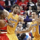 Portland Trail Blazers guard Nolan Smith, left, looks for help as Los Angeles Lakers' Pau Gasol, middle, and Steve Nash defend during the first quarter of an NBA basketball game in Portland, Ore., Wednesday, Oct. 31, 2012. (AP Photo/Don Ryan)