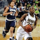 Notre Dame guard Jewell Loyd, right, drives the lane as Georgetown guard Jasmine Jackson gives chase during the first half of an NCAA college basketball game, Tuesday, Jan. 15, 2013, in South Bend, Ind. (AP Photo/Joe Raymond)