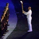 Steve Redgrave holds the torch during the Opening Ceremony at the 2012 Summer Olympics, Friday, July 27, 2012, in London. (AP Photo/Paul Sancya)