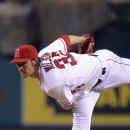 Los Angeles Angels starting pitcher C.J. Wilson throws to the plate during the third inning of their baseball game against the Texas Rangers, Saturday, June 2, 2012, in Anaheim, Calif.  (AP Photo/Mark J. Terrill)