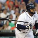 Detroit Tigers Prince Fielder throws his bat after hitting a two-run home run during the fourth inning of a baseball game against the Cleveland Indians in Detroit, Friday, Aug. 3, 2012. (AP Photo/Carlos Osorio)