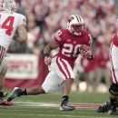 In this Nov. 17, 2012, photo, Wisconsin's James White carries during an NCAA college football game against Ohio State in Madison, Wis. Wisconsin has opened spring practices this month without Montee Ball in the backfield for the first time since 2008. The Badgers will be counting on senior tailback White, who enters 2013 as the NCAA's rushing leader among active running backs with 2,571 career yards. (AP Photo/Andy Manis)