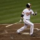 Baltimore Orioles' Matt Wieters watches his solo home run in the second inning of a baseball game against the Tampa Bay Rays on Tuesday, April 16, 2013, in Baltimore. (AP Photo/Patrick Semansky)