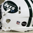 A decal honoring the victims of the Sandy Hook Elementary School shootings in Newtown, Conn., appears on a New York Jets helmet before an NFL football game between the Jets and the Tennessee Titans, Monday, Dec. 17, 2012, in Nashville, Tenn. (AP Photo/Wade Payne)