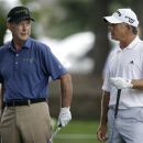 Larry Nelson, left, talks with Mike Goodes before hitting off the first tee during the second round of the Champions Tour's Principal Charity Classic golf tournament, Saturday, June 2, 2012, in West Des Moines, Iowa. (AP Photo/Charlie Neibergall)
