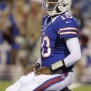 Buffalo Bills' Vince Young kneels on the turf after throwing an interception against the Pittsburgh Steelers during the second half of a preseason NFL football game in Orchard Park, N.Y., Saturday, Aug. 25, 2012. The Steelers won 38-7. (AP Photo/Gary Wiepert)