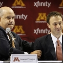 Minnesota athletic director Norwood Teague, left, introduces Richard Pitino as the new men's basketball coach at a news conference, Friday, April 5, 2013, in Minneapolis. (AP Photo/The Star Tribune, Brian Peterson)