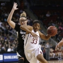Stanford's Amber Orrange (33) tries to drive past Colorado's Jen Reese during the first half of an NCAA college basketball game in the Pac-12 Conference tournament Saturday, March 9, 2013, in Seattle. (AP Photo/Elaine Thompson)
