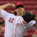 Cincinnati Reds starting pitcher Bronson Arroyo throws against the Philadelphia Phillies in the first inning of a baseball game, Monday, April 15, 2013, in Cincinnati. (AP Photo/Al Behrman)