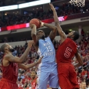North Carolina's P.J. Hairston (15) drives to the basket between North Carolina State's Richard Howell, left, and C.J. Leslie (5) during the first half of an NCAA college basketball game in Raleigh, N.C., Saturday, Jan. 26, 2013.  (AP Photo/Ted Richardson)