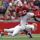 Wisconsin running back Melvin Gordon (25) runs over UTEP defensive back DeShawn Grayson during the first half of a NCAA college football game, Saturday, Sept. 22, 2012, in Madison, Wis. (AP Photo/Andy Manis)