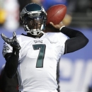 Philadelphia Eagles quarterback Michael Vick (7) warms up before an NFL football game against the New York Giants, Sunday, Dec. 30, 2012, in East Rutherford, N.J. (AP Photo/Kathy Willens)