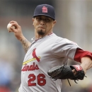 File-This April 22, 2012 file photo shows St. Louis Cardinals pitcher Kyle Lohse throwing in the first inning of a baseball game against the Pittsburgh Pirates in Pittsburgh.  Lohse and the Brewers completed a three-year contract worth $33 million on Monday march 25, 2013, a big boost to their suspect rotation exactly a week before the season opener at home against Colorado.  (AP Photo/Gene J. Puskar, File)
