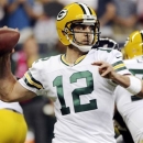 Green Bay Packers quarterback Aaron Rodgers (12) throws against the Houston Texans in the first quarter of an NFL football game, Sunday, Oct. 14, 2012, in Houston. (AP Photo/Dave Einsel)