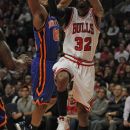 CHICAGO, IL - APRIL 10: Richard Hamilton #32 of the Chicago Bulls shoots under pressure from Baron Davis #85 of the New York Knicks at the United Center on April 10, 2012 in Chicago, Illinois. The Bulls defeated the Knicks 98-86. (Photo by Jonathan Daniel/Getty Images)