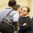 Alabama coach Nick Saban talks with an NFL scout during pro day at the University of Alabama on Wednesday, Feb. 13, 2013, in Tuscaloosa, Ala. (AP Photo/Butch Dill)