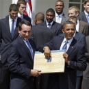 FILE - In this May 27, 2010 file photo, President Barack Obama looks over the bracket with coach Mike Krzyzewski of the NCAA basketball champion Duke Blue Devils in the Rose Garden of the White House in Washington, where he honored the team. The odds of completing the perfect bracket by picking the higher-seeded team are 35 billion to 1. (AP Photo/Alex Brandon, File)