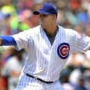 Chicago Cubs starter Paul Maholm delivers a pitch against the St. Louis Cardinals in the first inning during a baseball game in Chicago, Sunday, July 29, 2012. (AP Photo/Paul Beaty)