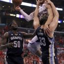 Los Angeles Clippers' Blake Griffin, right, gets called with a charging foul on  Memphis Grizzlies' Marc Gasol as Zach Randolph looks on  during the first half of a NBA first-round playoff basketball game in Los Angeles, Monday, May 7, 2012. (AP Photo/Chris Carlson)