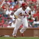 St. Louis Cardinals' Matt Adams watches his RBI double during the seventh inning of a baseball game against the Cincinnati Reds Wednesday, April 10, 2013, in St. Louis. The Cardinals won 10-0. (AP Photo/Jeff Roberson)