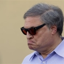 Miami Marlins owner Jeffrey Loria reacts during a news conference outside of the team's spring training facility before an exhibition spring training baseball game against the New York Mets, Tuesday, Feb. 26, 2013, in Jupiter, Fla. (AP Photo/Julio Cortez)