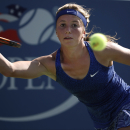 Annika Beck, of Germany, returns a shot against Sloane Stephens, of the United States, during the opening round of the 2014 U.S. Open tennis tournament, Monday, Aug. 25, 2014, in New York. (AP Photo/Kathy Willens)