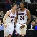 UT Arlington's Drew Charles (4) and Kevin Butler react after beating Utah State during a Western Athletic Conference tournament NCAA college basketball game, Thursday, March 14, 2013 in Las Vegas. UT Arlington won 83-78. (AP Photo/David Becker)