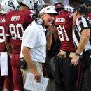 South Carolina head coach Steve Spurrier discusses a call with an official during the first half of an NCAA college football game against North Carolina, Thursday, Aug. 29, 2013, in Columbia, S.C. (AP Photo/Stephen Morton)