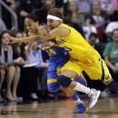 UCLA's Mariah Williams (14) and California's Layshia Clarendon chase a loose ball in the first half of an NCAA college basketball game in the Pac-12 Conference tournament Saturday, March 9, 2013, in Seattle. (AP Photo/Elaine Thompson)