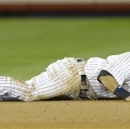 New York Yankees shortstop Derek Jeter reacts after injuring himself in the 12th inning of Game 1 of the American League championship series against the Detroit Tigers early Sunday, Oct. 14, 2012, in New York.(AP Photo/Paul Sancya )