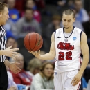 Mississippi guard Marshall Henderson (22) hands the ball to a referee during the first half of a third-round game against La Salle in the NCAA college basketball tournament at the Sprint Center in Kansas City, Mo., Sunday, March 24, 2013. (AP Photo/Orlin Wagner)