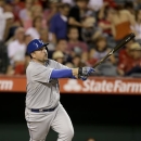 Kansas City Royals' Billy Butler hits a two-RBI double against the Los Angeles Angels during the sixth inning of a baseball game in Anaheim, Calif., Monday, May 13, 2013. (AP Photo/Jae C. Hong)
