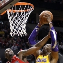 Los Angles Lakers center Dwight Howard, right, is fouled while shooting by Portland Trail Blazers guard Wesley Matthews during the first quarter of an NBA basketball game in Portland, Ore., Wednesday, Oct. 31, 2012. (AP Photo/Don Ryan)
